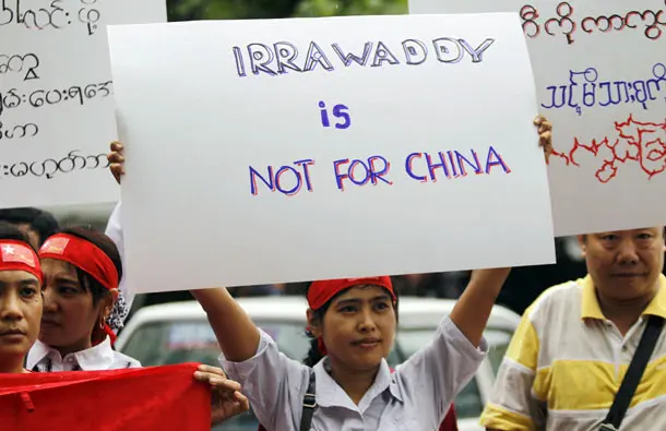 Myanmareses living in Malaysia display placards in protest against the Myitsone dam project, outside Myanmar embassy in Kuala Lumpur
