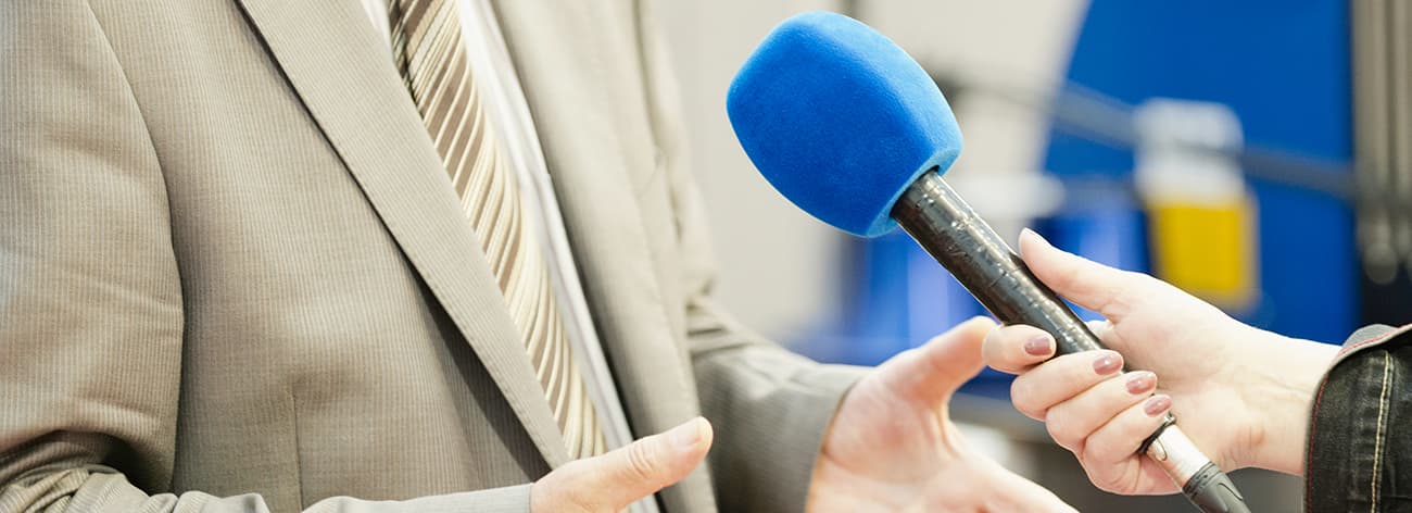 Journalist interviewing businessman