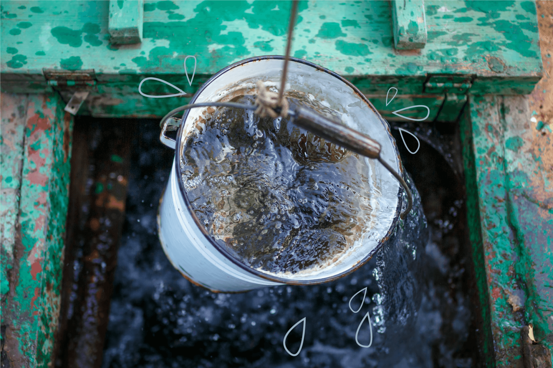 Clean and clear rainwater in a bucket is raised from a well (ovbelov / Shutterstock)