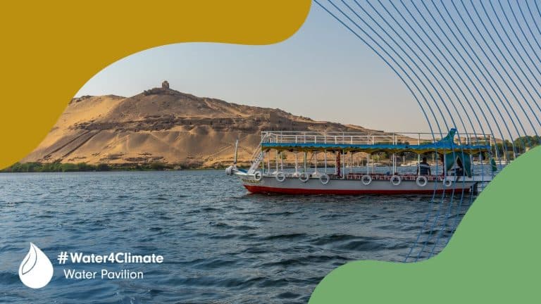Boat riding the Nile river - with Water Pavilion branding: green and mustard shapes in the corners