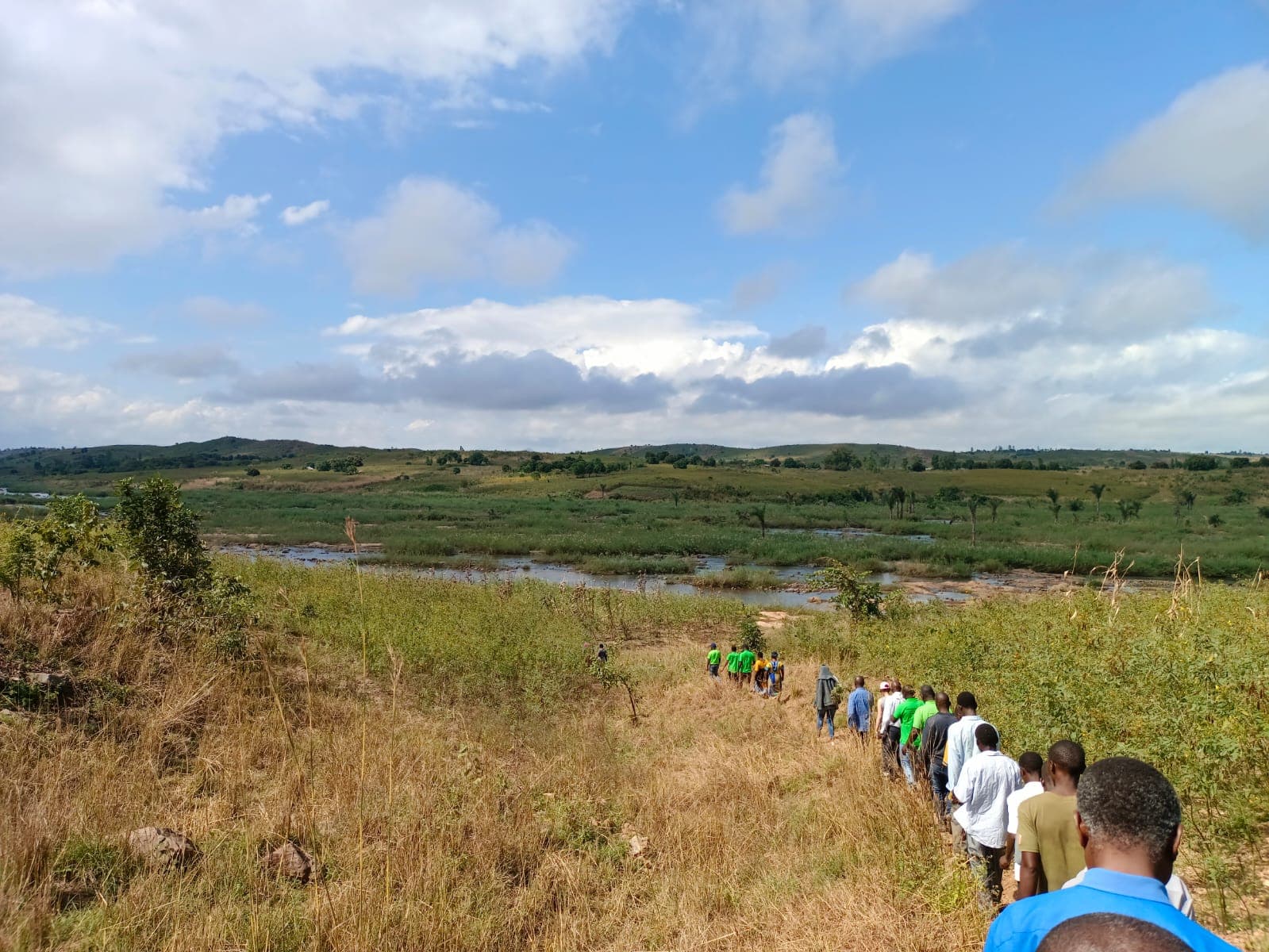 People walking on a field of grass