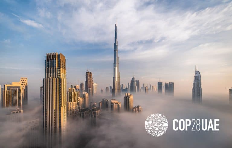Skyscrapers of the city of Dubai through low clouds