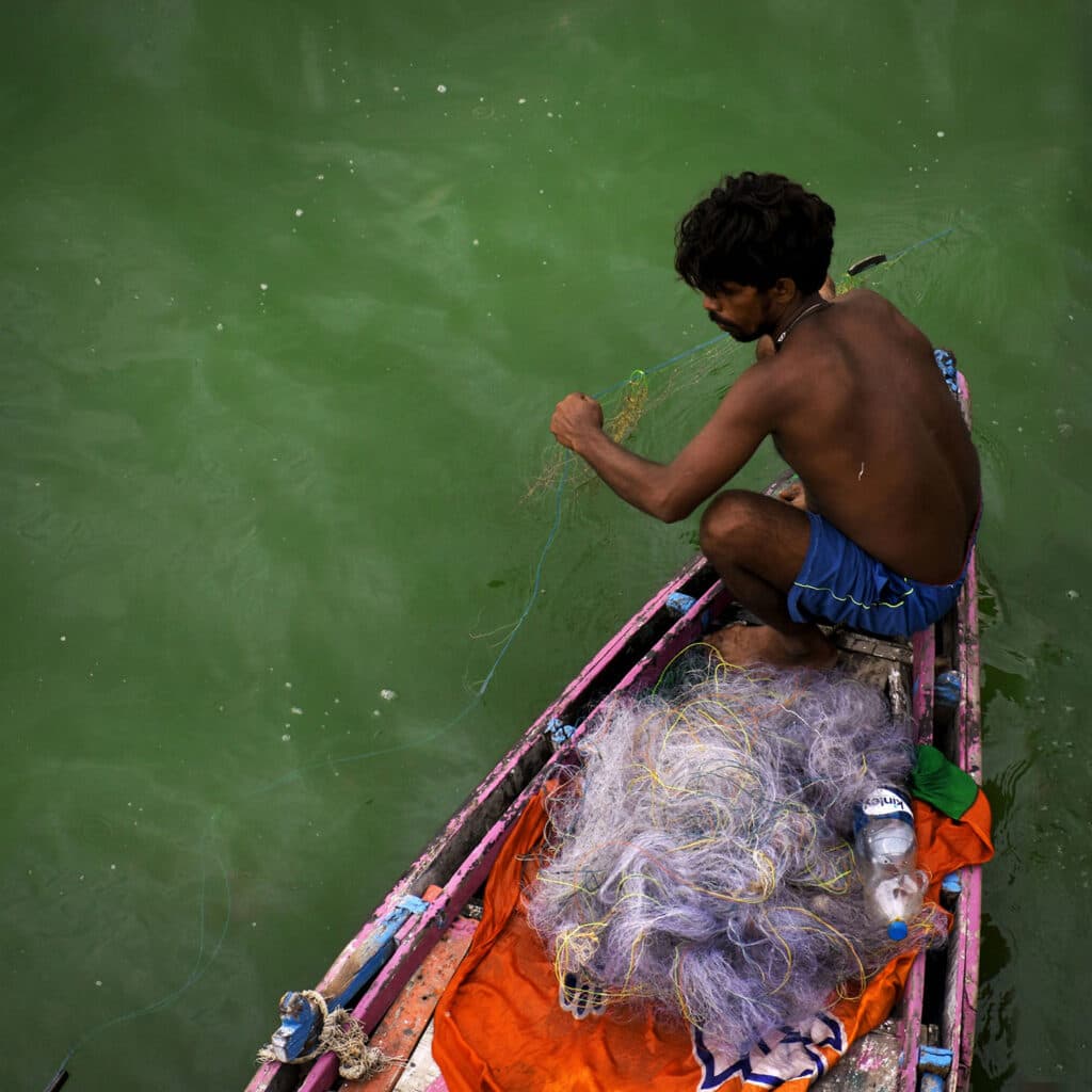 Fishing at Assi ghat, Varanasi, India.