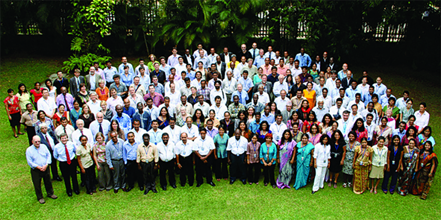 The International Water Management Institute team gathered in a green park - photo taken from above