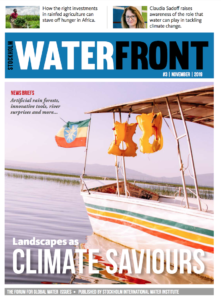 Cover of Waterfront magazine showing a boat with an Ethiopian flag and lifevests hanging from its roof.