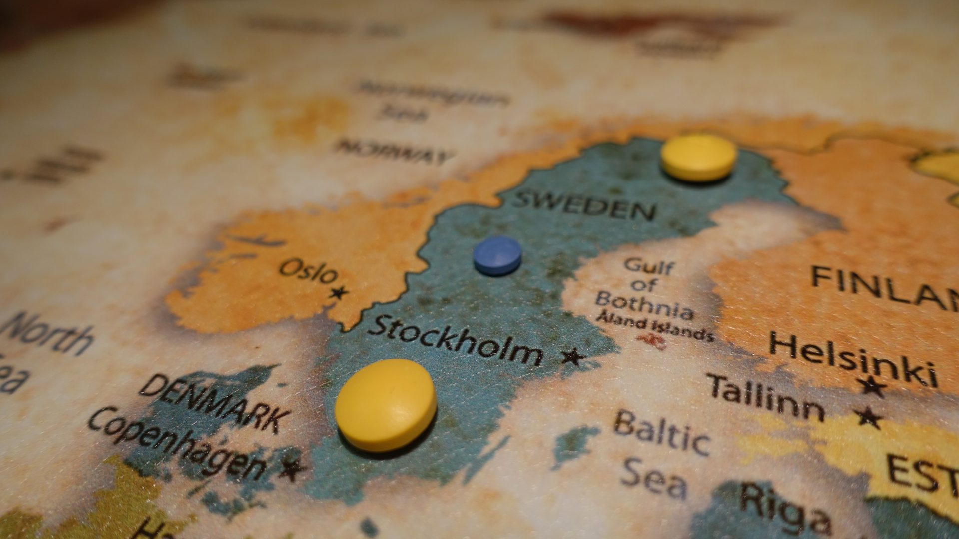 Pills on a printed map of Sweden highlighting the capital of Stockholm