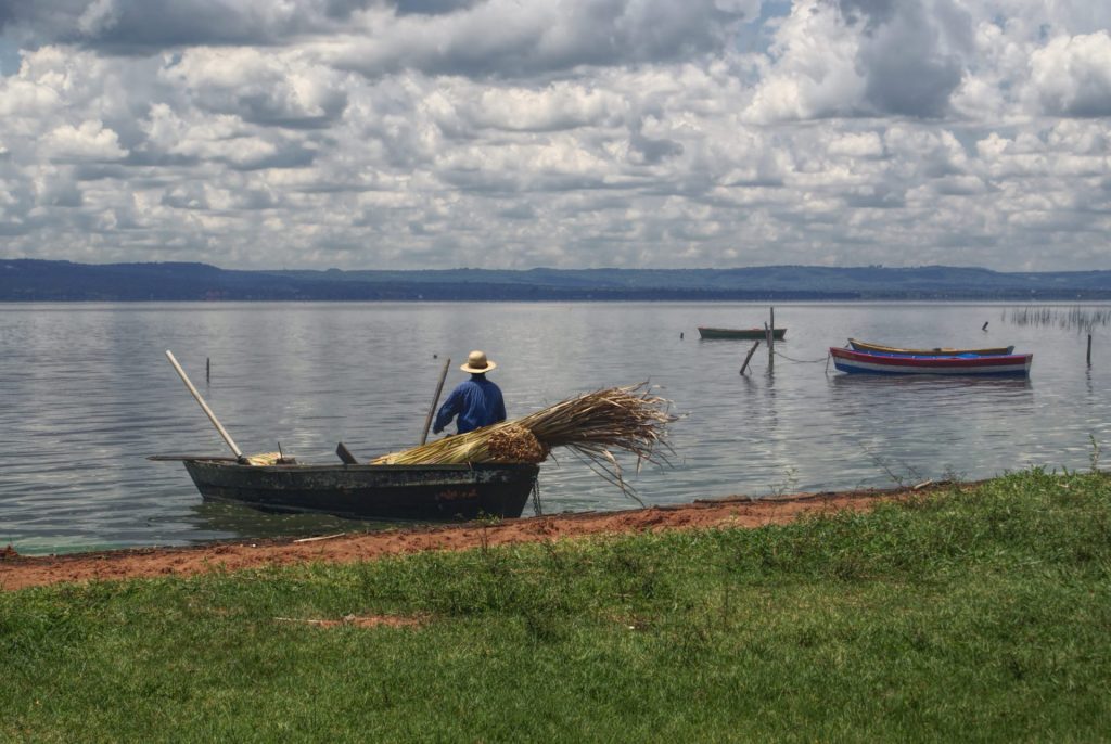 Fisherman leaving the river bank in Paraguay