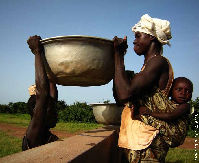 People passing one basin to another (with baby on the back)