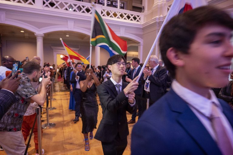 Young people entering the Norra Latin auditorium with their respective national flags during the awards ceremony of the SJWP in World Water Week 2022