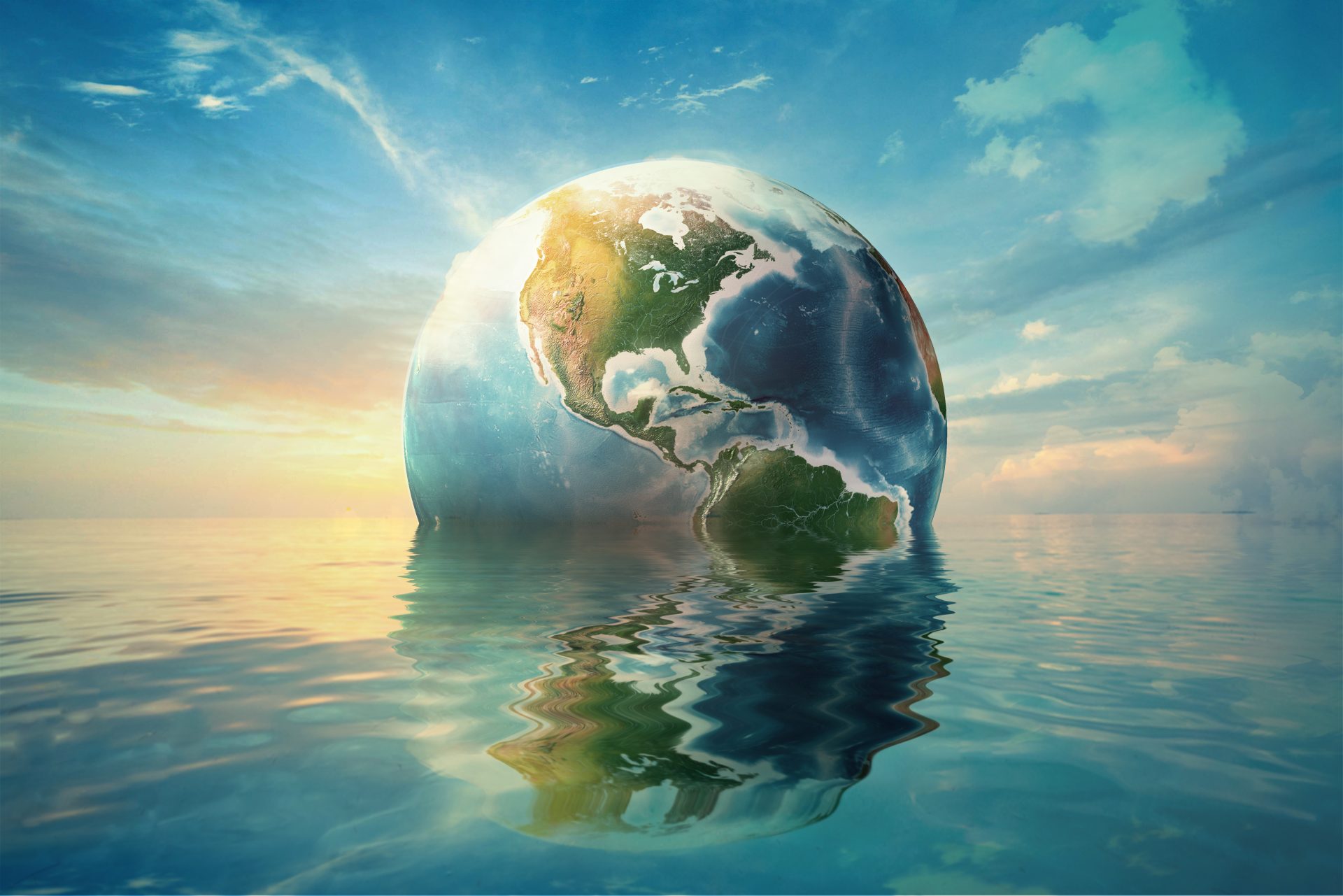 Digital illustration of the Earth floating in water. A sun ray lighting the glob from behind