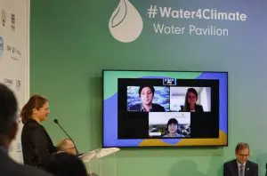 Dr Malin Lundberg Ingemarsson presenting the newly launched report at the Water Pavilion during COP2