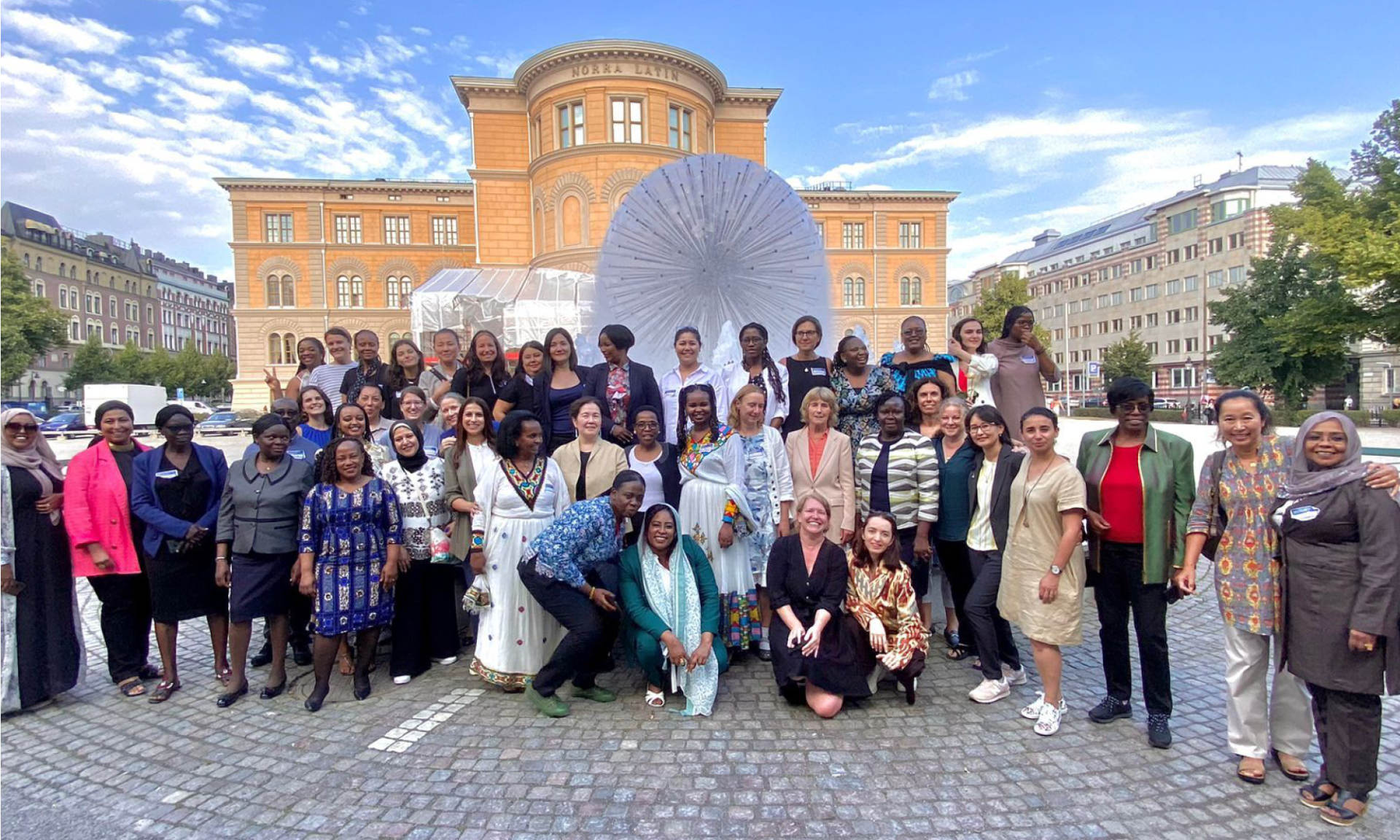 Members of the Women in Water Diplomacy Network gathered at World Water Week 2022, outside, in front of Norra Latin