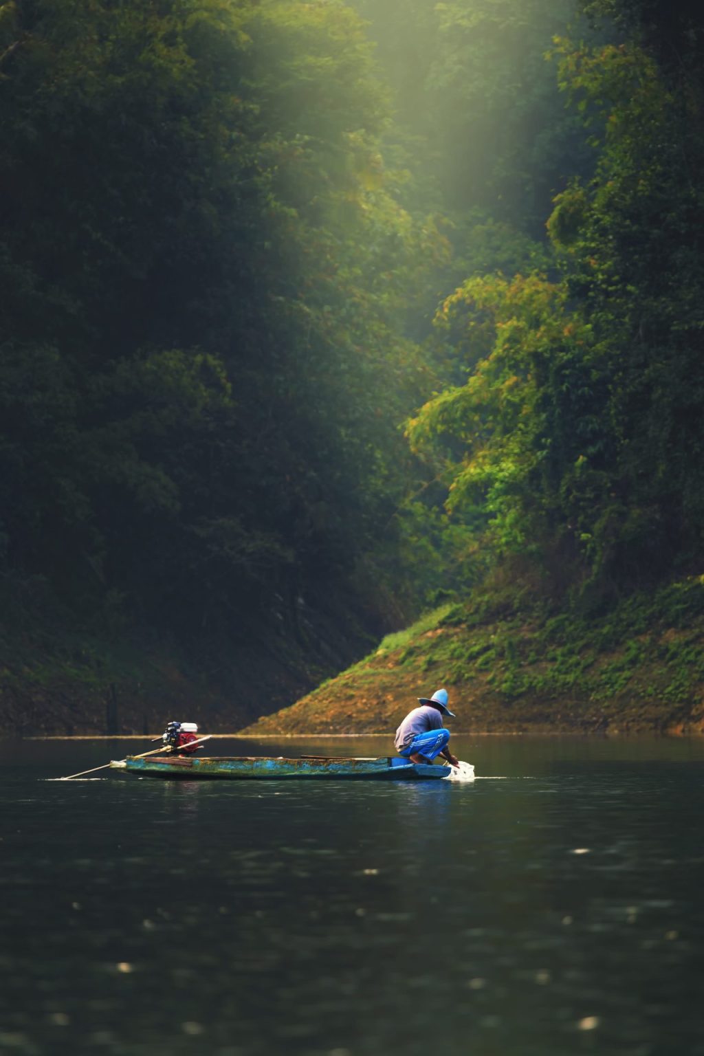 person fishing on a river