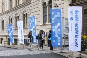 People entering a building with World Water week banners