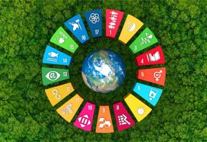 Wheel of all SDG, surrounding planet Earth, on top of a green canopy