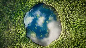 An almost perfect circular lake shot straight down from the air resembles the earth surrounded by a 