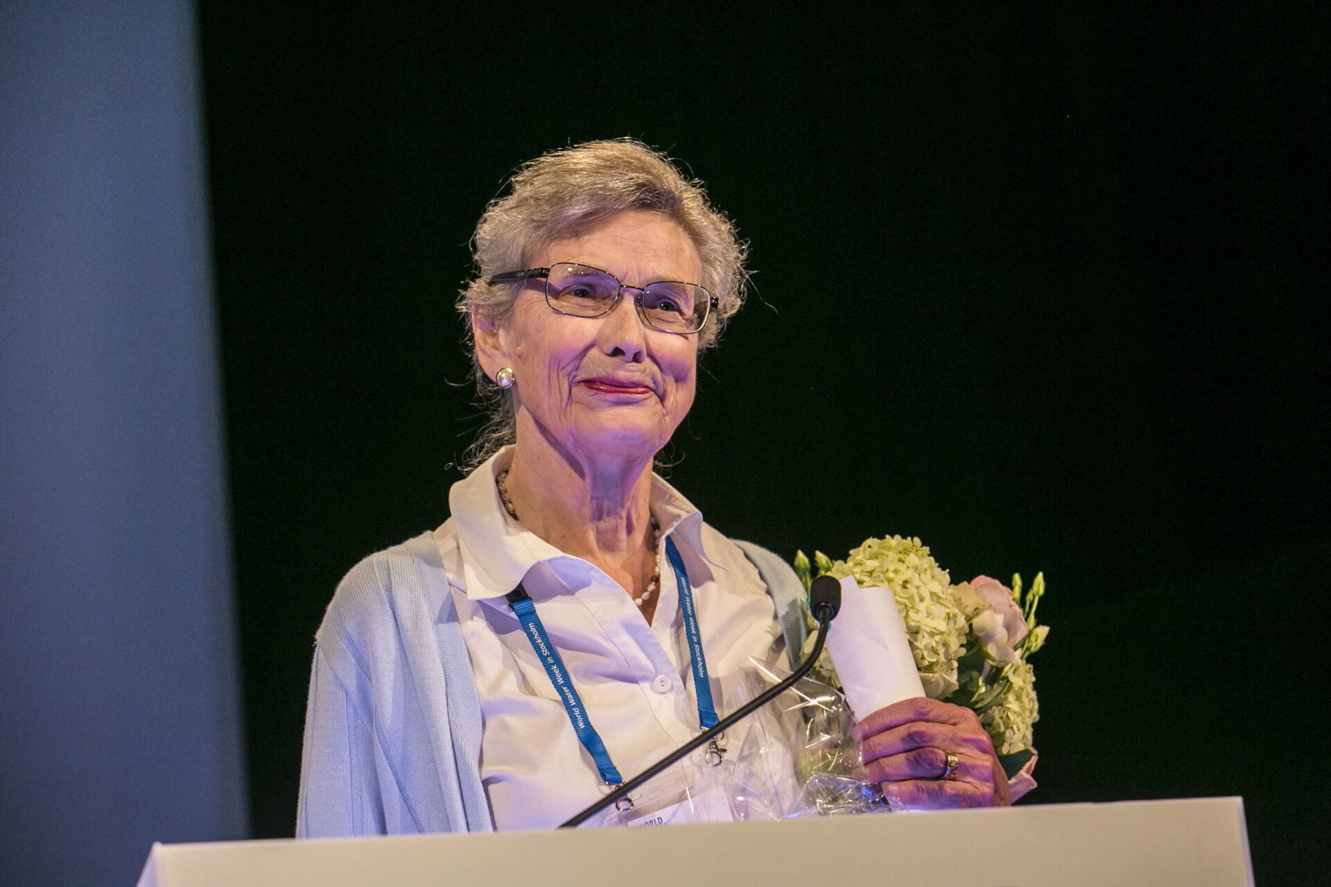 Professor Malin Flakenmark holding a flower bouquet after a talk at World Water Week 2015