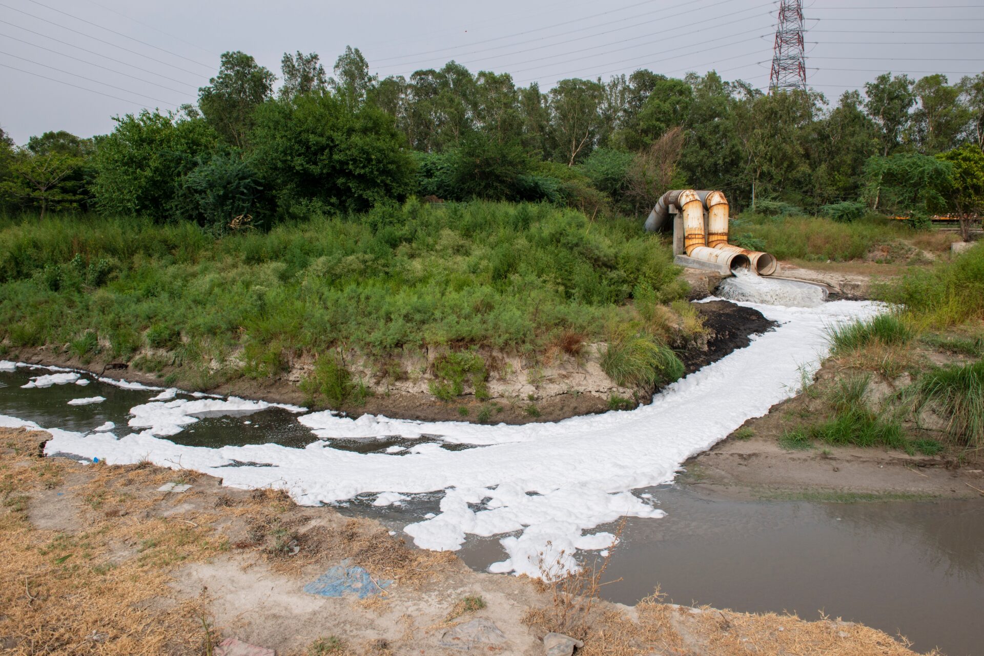 New Delhi, India-May 23 2022: city waste water falling in River Yamuna in New Delhi, India
